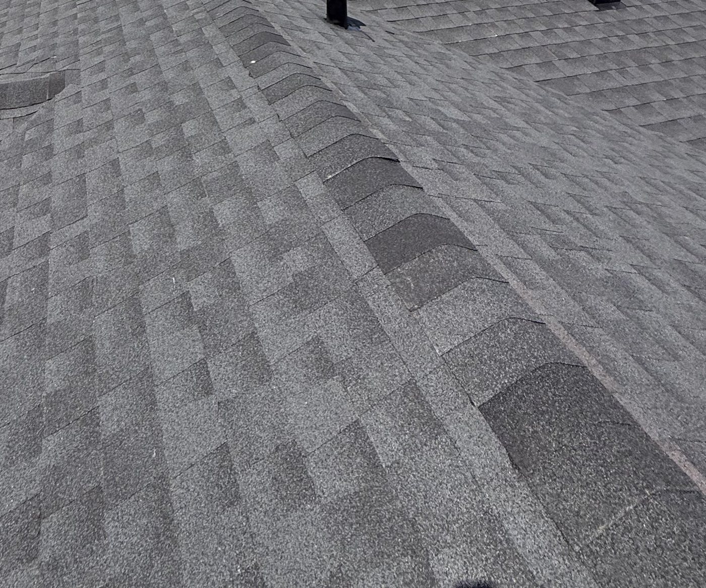 Close-up of finished hip cap and shingle coursing detail