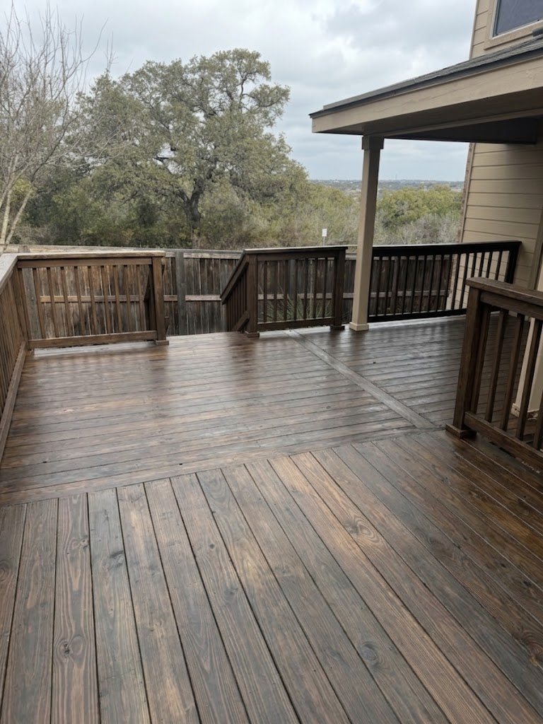 Dark walnut stained deck with a hill-country view &mdash; finish visualization
