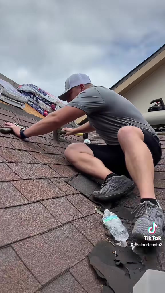 Joshua Holmes at work on a roof