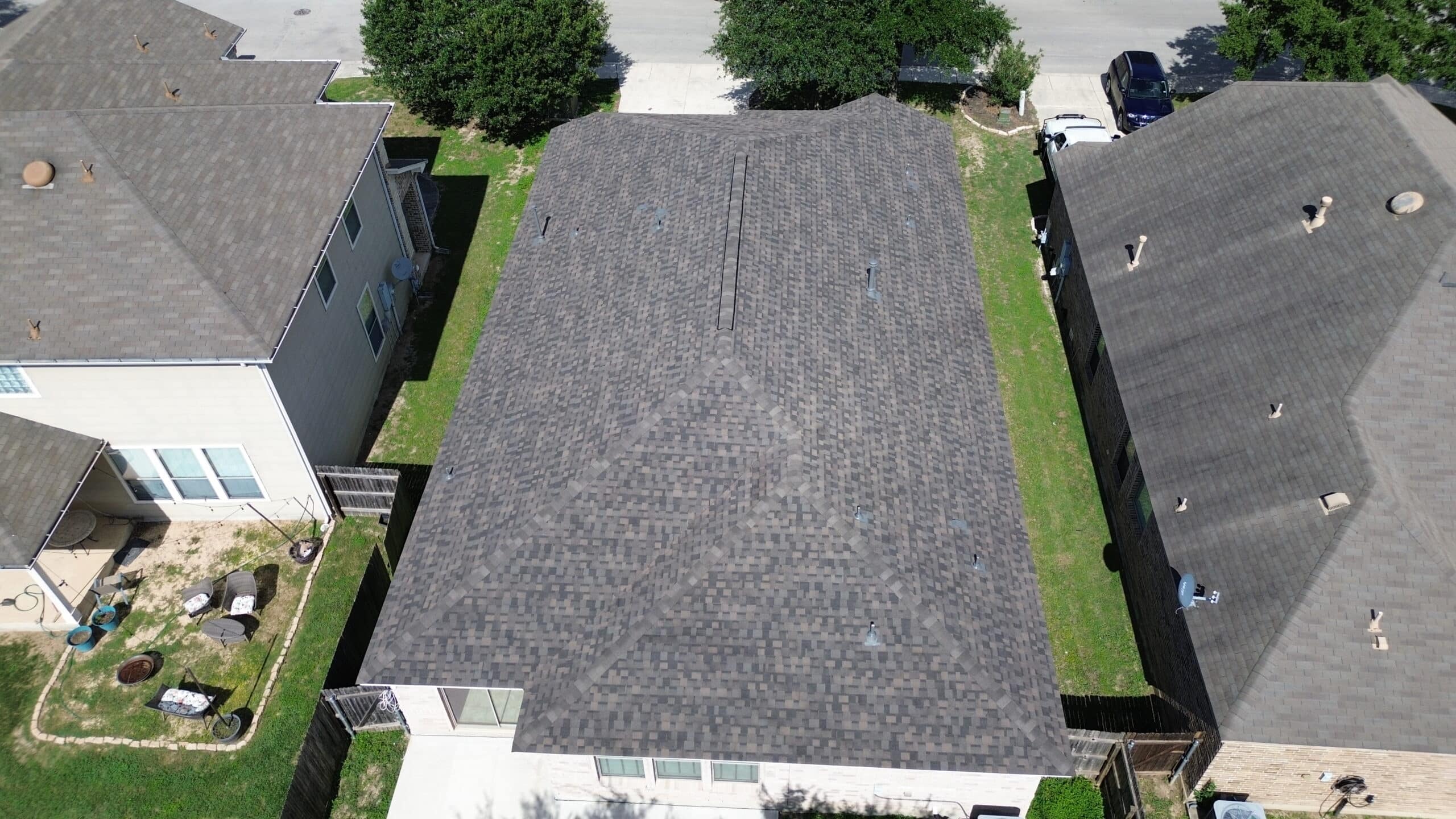 Aerial view of completed roofs, residential neighborhood
