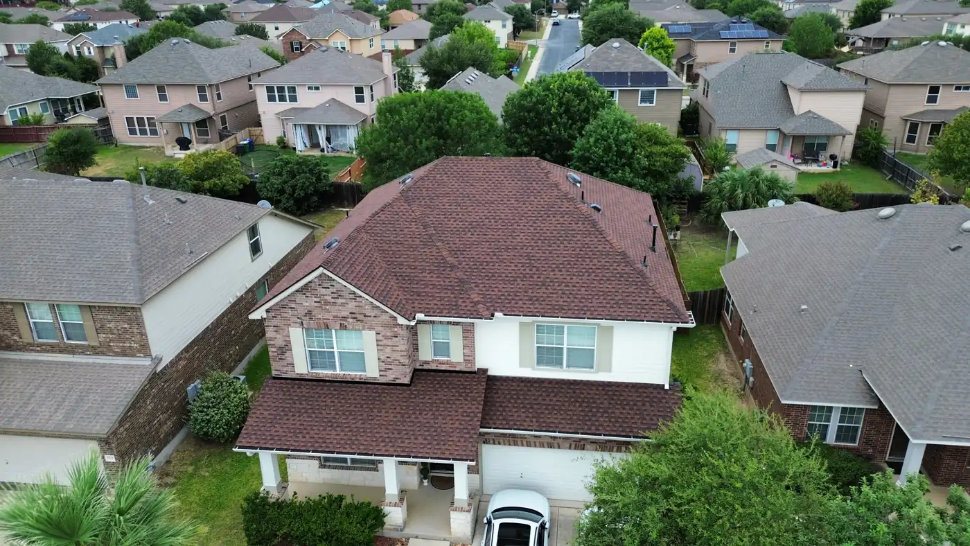 Drone view of a completed roof replacement on a two-story home in far-west San Antonio, TX (78245), July 2025