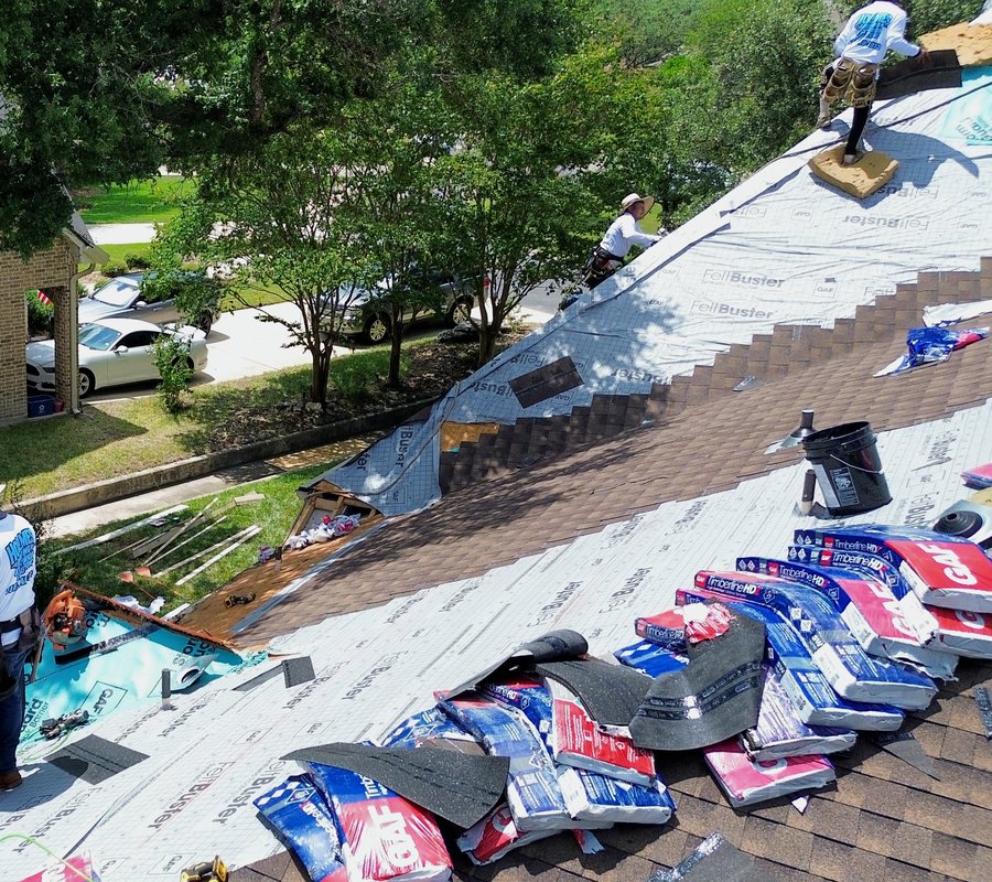 Holmes Roofing crew installing a new roof, aerial view