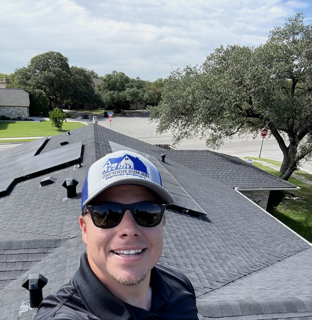 Joshua Holmes on a completed roof, San Antonio TX